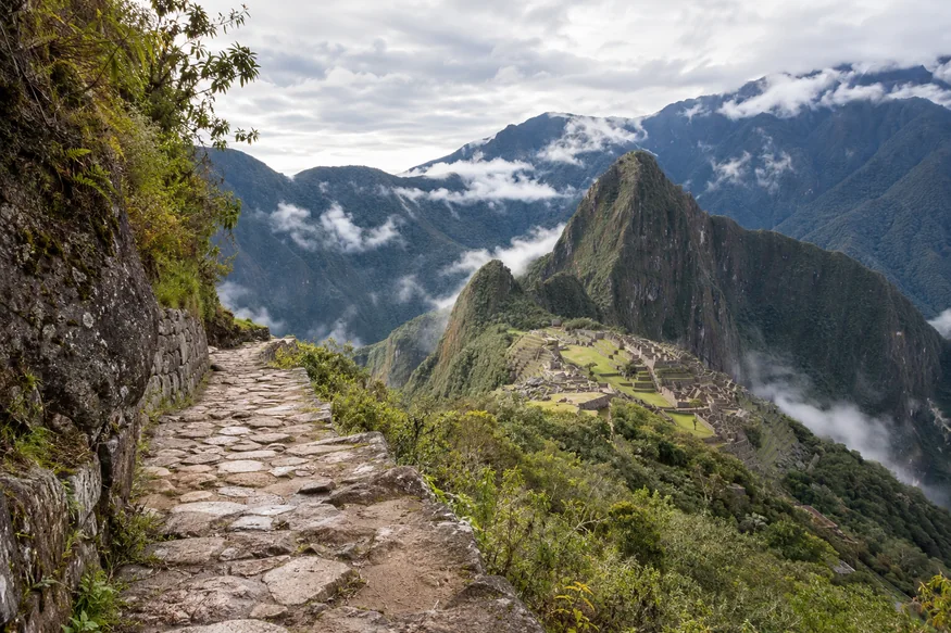 Stone trail toward Intipunku overlooking Machu Picchu and the Andes