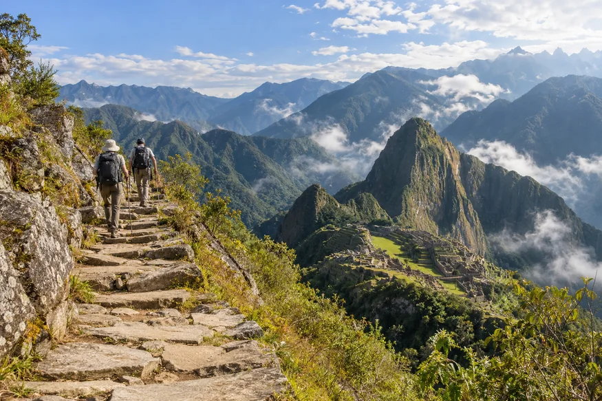 Hikers ascending the open Machu Picchu Mountain trail above the sanctuary