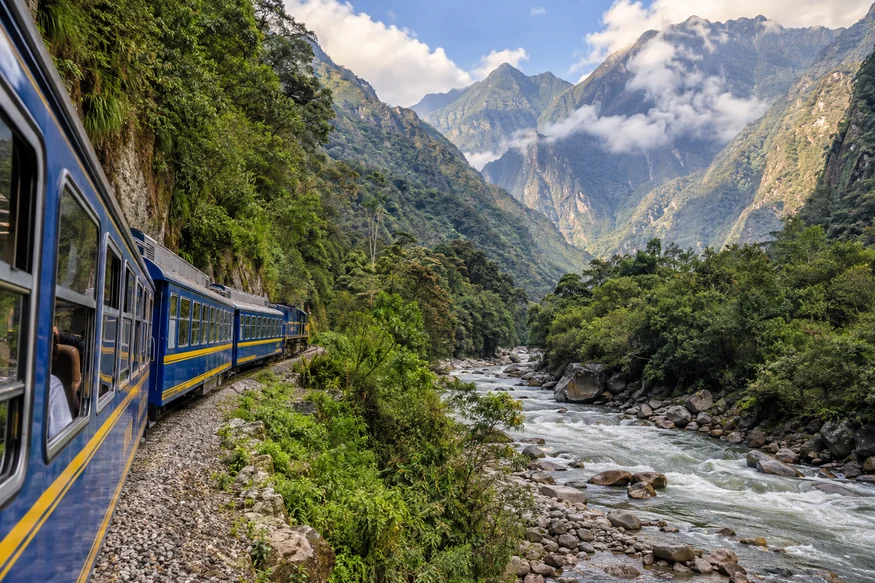 Train traveling beside the Urubamba River toward Machu Picchu