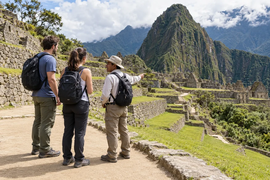 Travelers reviewing the walking route across Machu Picchu with a local guide